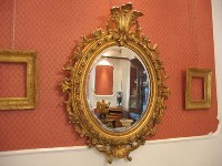 antica specchiera ovale in oro fino napoleone III