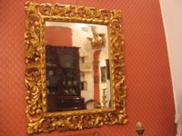 Antica specchiera intagliata del 700 con oro a foglie